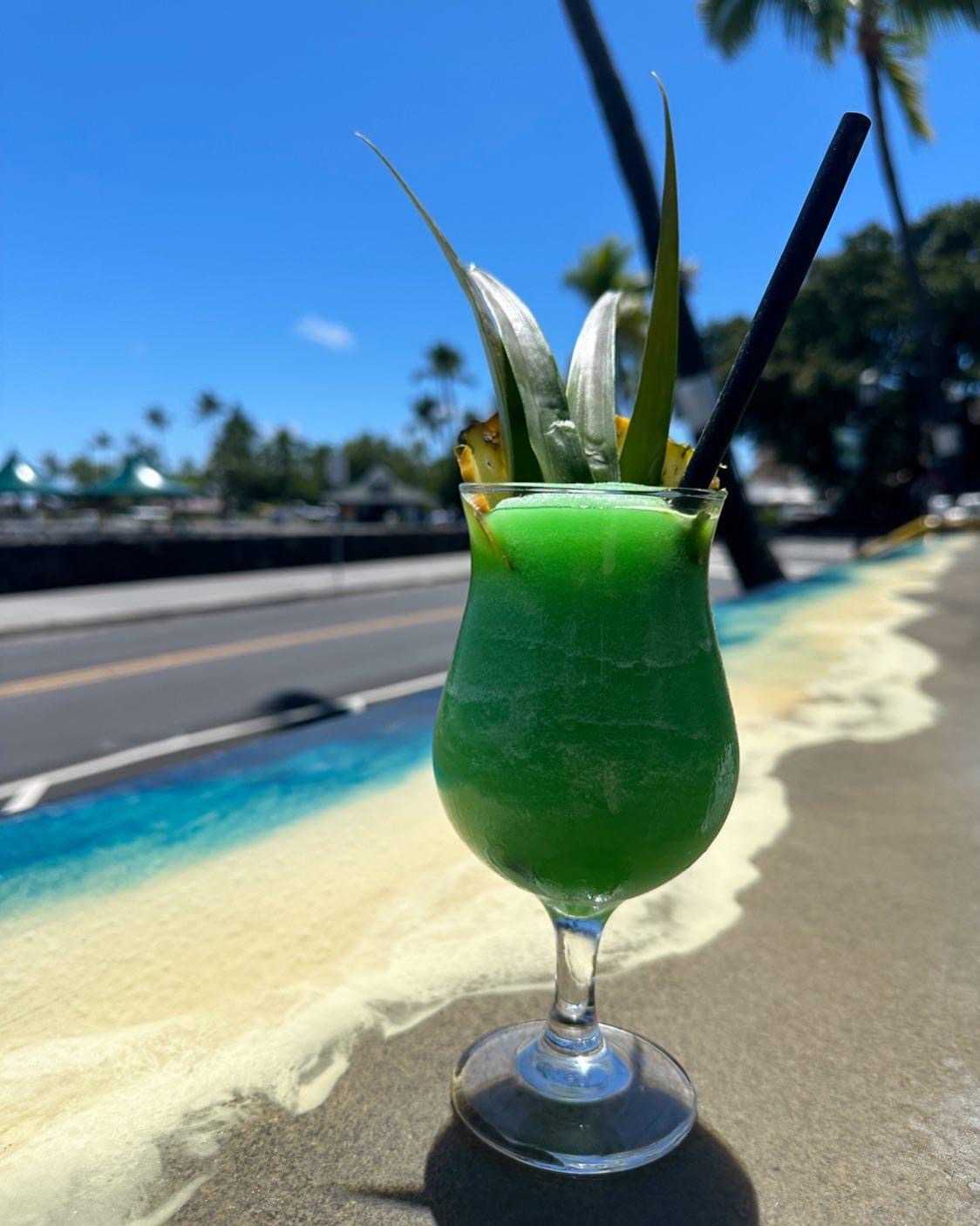 Green Big Island cocktail under blue sky