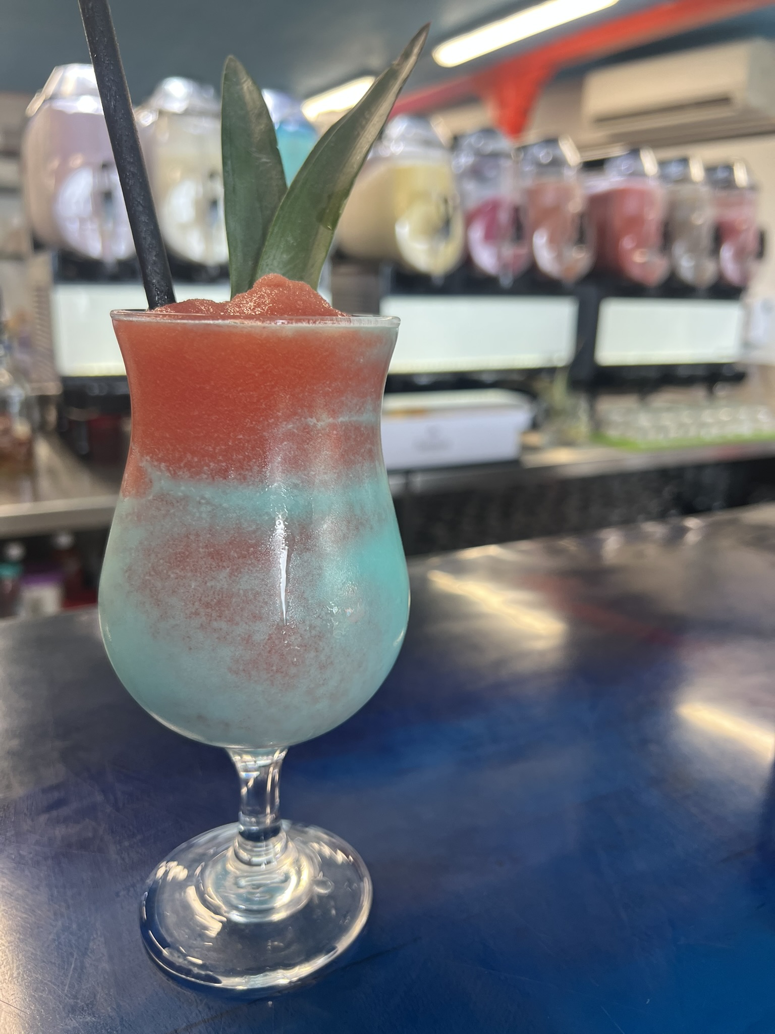 Layered blue and pink frozen cocktail